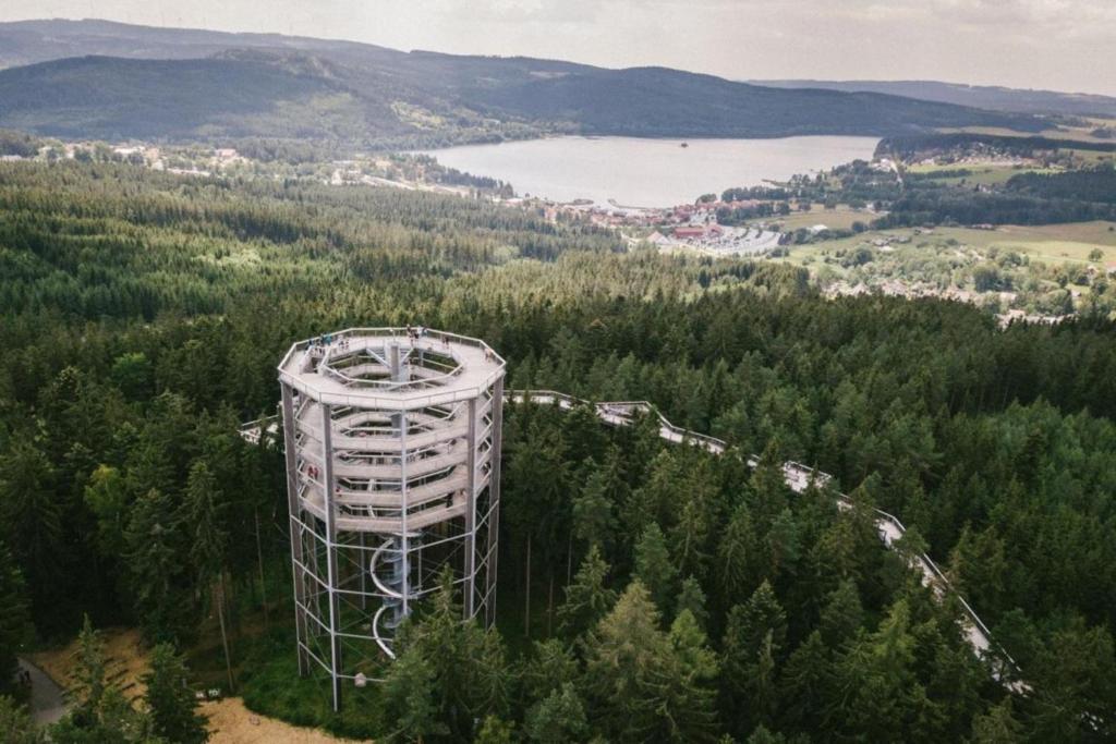 an observation tower in the trees with a roller coaster at Promenáda Jasmin Lucy - Myši v botě in Lipno nad Vltavou