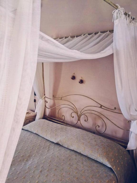Posteľ alebo postele v izbe v ubytovaní Palazzo Gambuzza