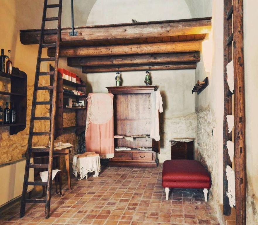 Posteľ alebo postele v izbe v ubytovaní Palazzo Gambuzza