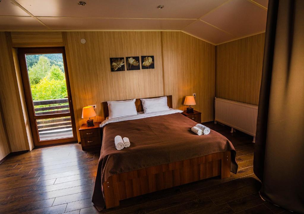 Postel nebo postele na pokoji v ubytování Hotel Banguriani