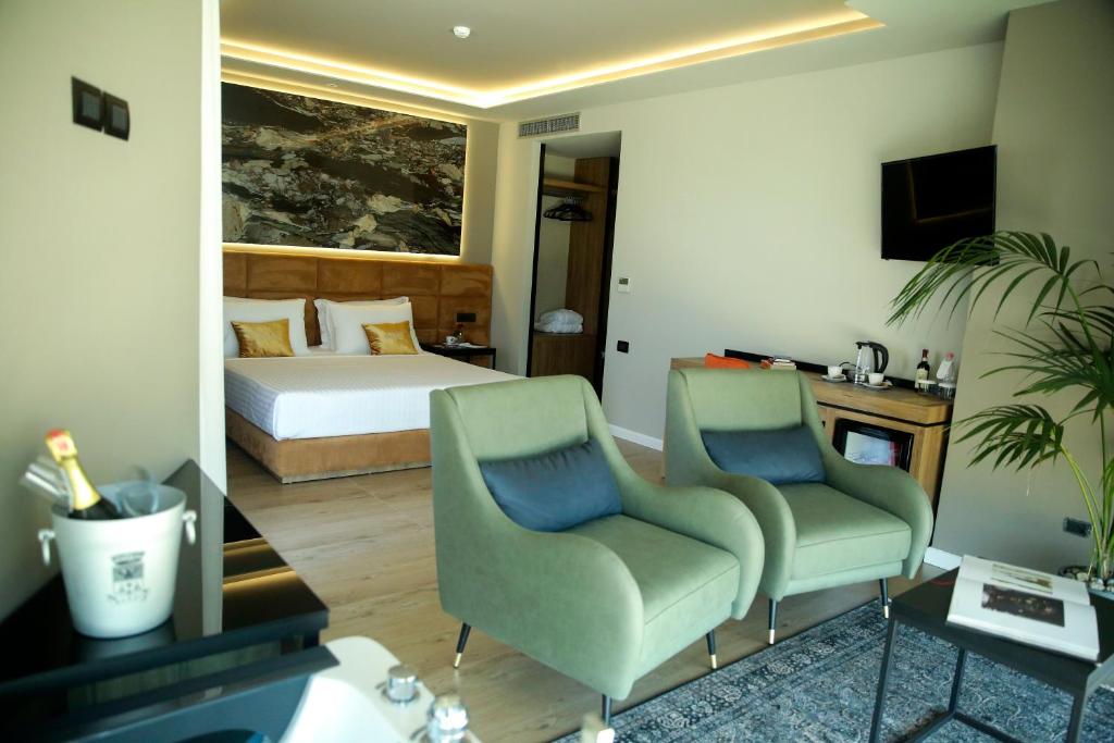 Uma televisão e/ou sistema de entretenimento em Kraal Hotel Vlore