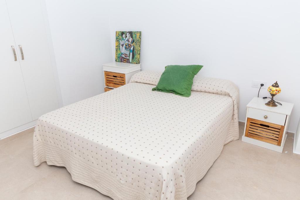 A bed or beds in a room at Cap de Mar CULLERA
