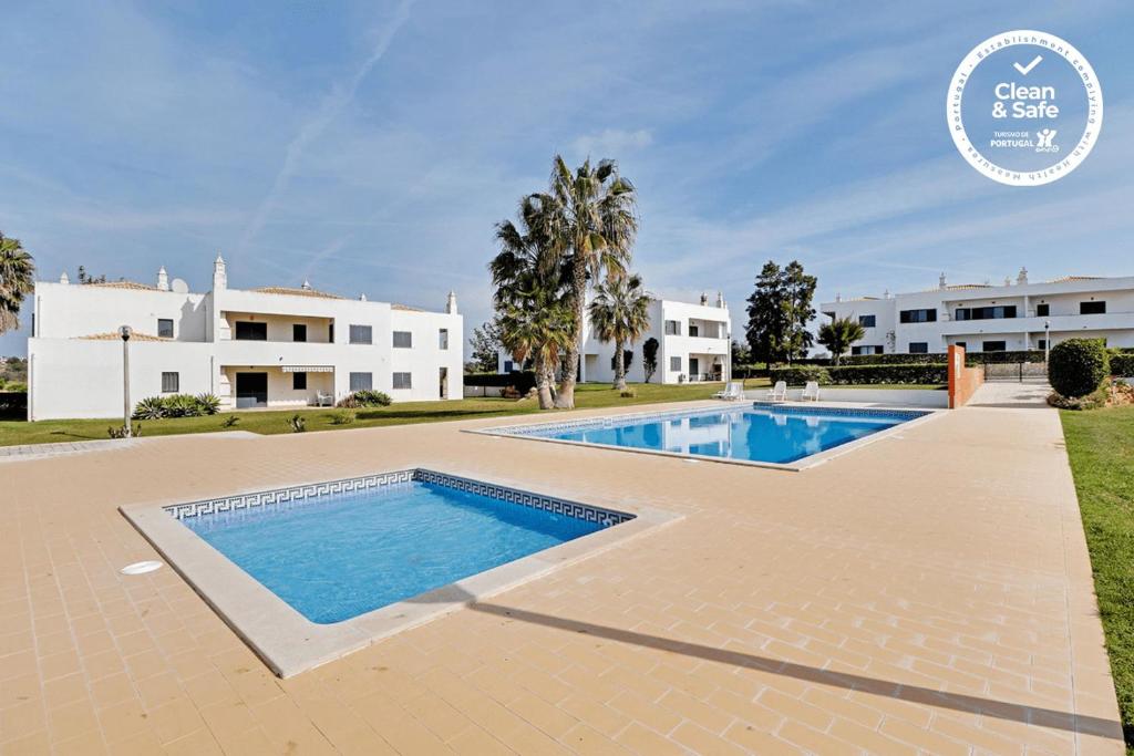 an image of a villa with a swimming pool at Pêra Secret Garden 1 and Pool by Homing in Pêra