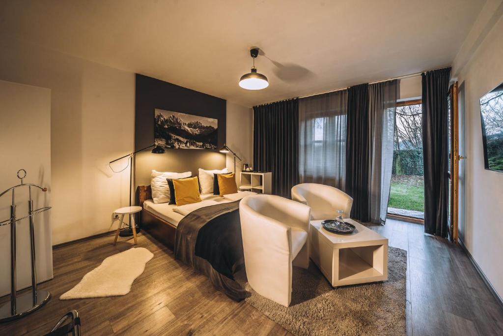 Postel nebo postele na pokoji v ubytování Boutique penzion Rech