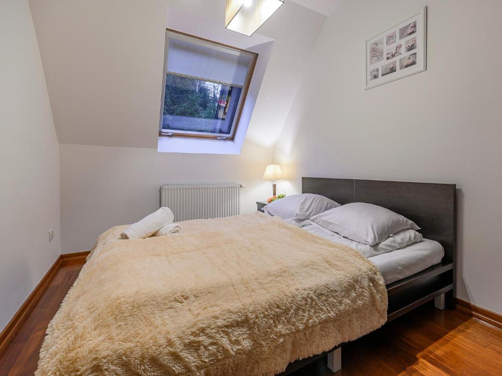 Posteľ alebo postele v izbe v ubytovaní VisitZakopane - Amber Apartment