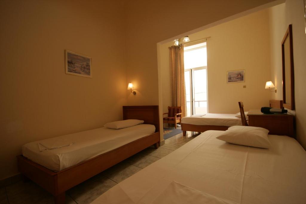 Posteľ alebo postele v izbe v ubytovaní Lena Hotel