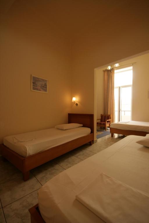 Posteľ alebo postele v izbe v ubytovaní Lena Hotel