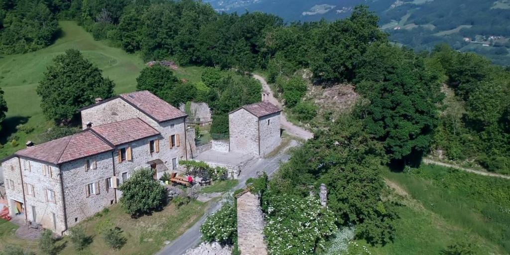 an aerial view of an old house on a hill at SacreTerre B&B e Agriturismo in Tizzano Val Parma