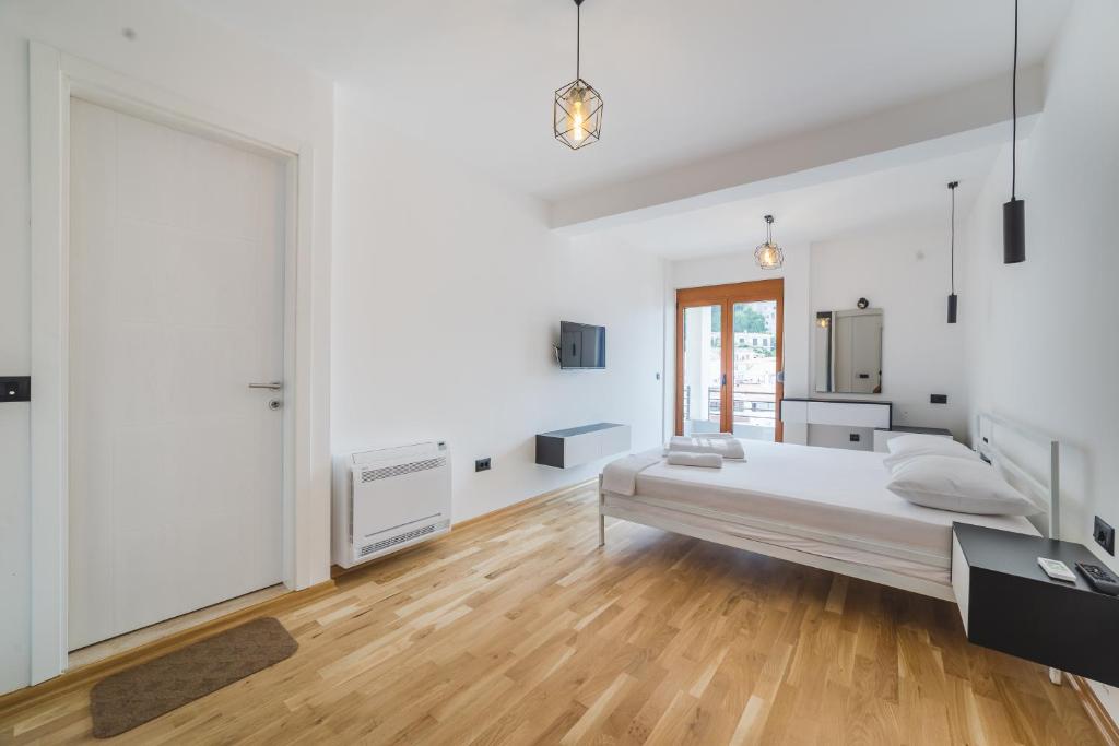 Postel nebo postele na pokoji v ubytování Poseidon Apartments