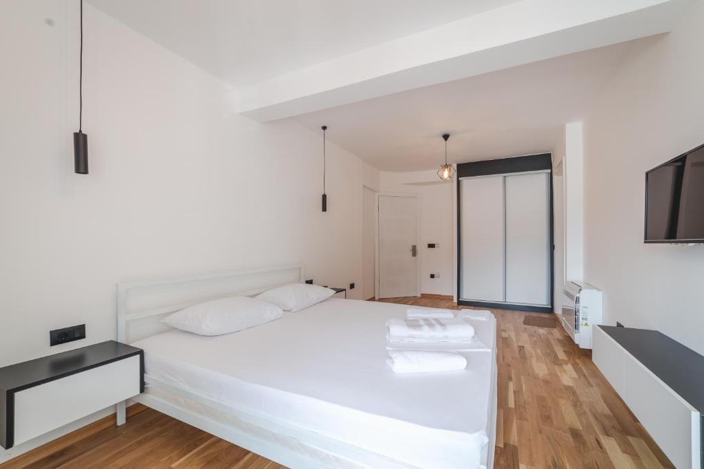 Postel nebo postele na pokoji v ubytování Poseidon Apartments