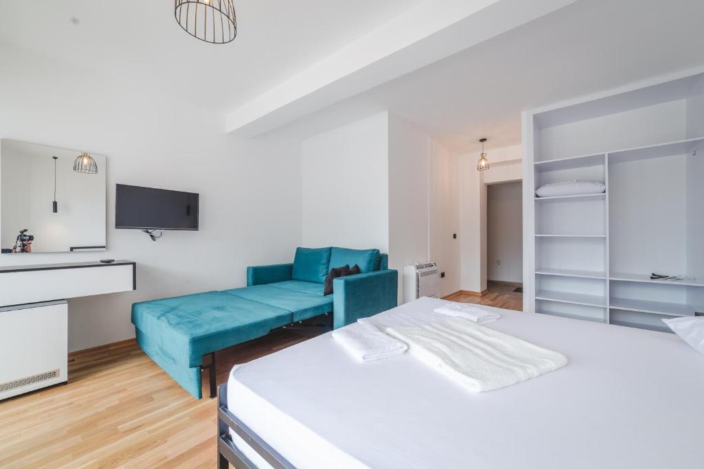 Postel nebo postele na pokoji v ubytování Poseidon Apartments