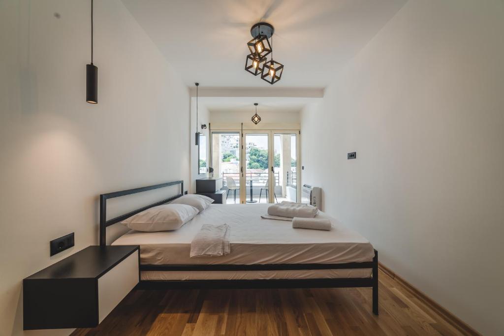 Postel nebo postele na pokoji v ubytování Poseidon Apartments
