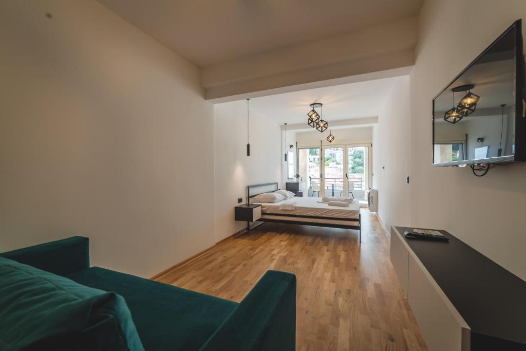 Postel nebo postele na pokoji v ubytování Poseidon Apartments
