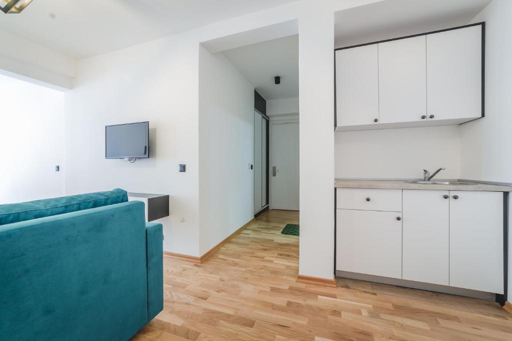 TV a/nebo společenská místnost v ubytování Poseidon Apartments