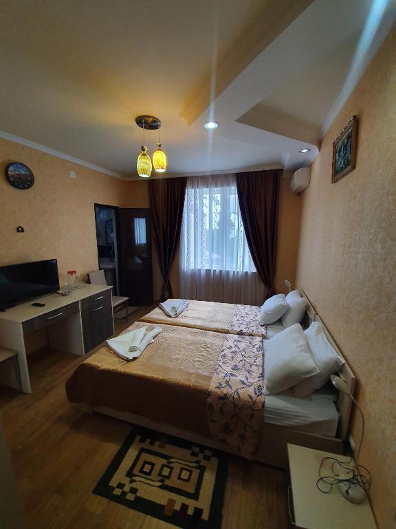 Voodi või voodid majutusasutuse Hotel Exotica toas