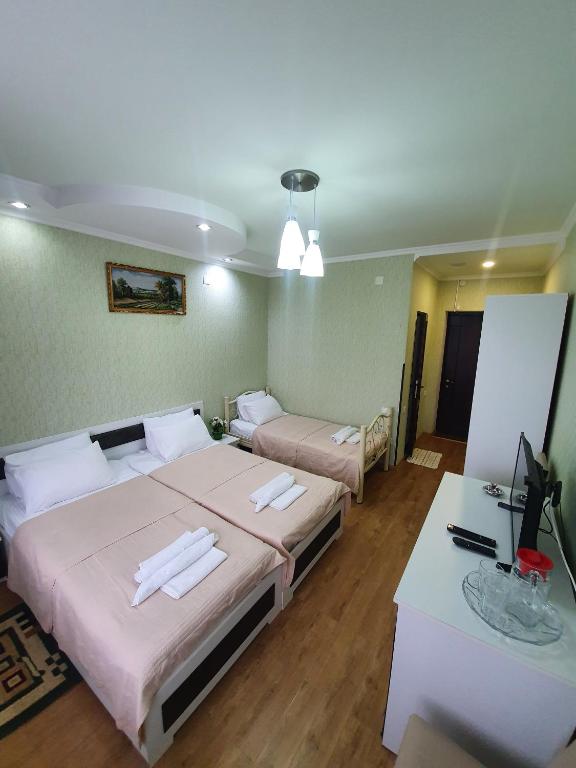 Voodi või voodid majutusasutuse Hotel Exotica toas