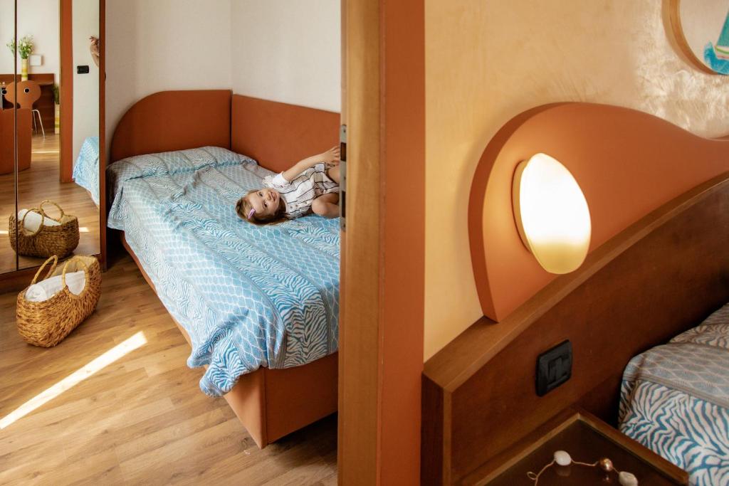 Postel nebo postele na pokoji v ubytování Miramare Hotel Ristorante Convegni