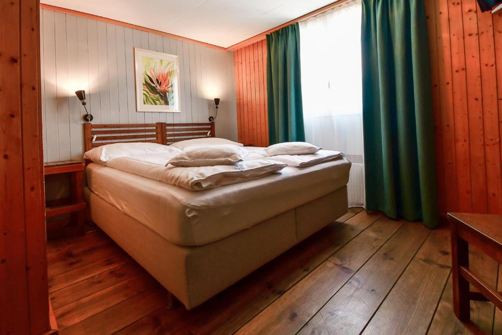 Letto o letti in una camera di Hotel Tell and Apartments