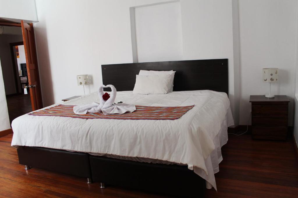 Postel nebo postele na pokoji v ubytování KAARO HOUSE CUSCO