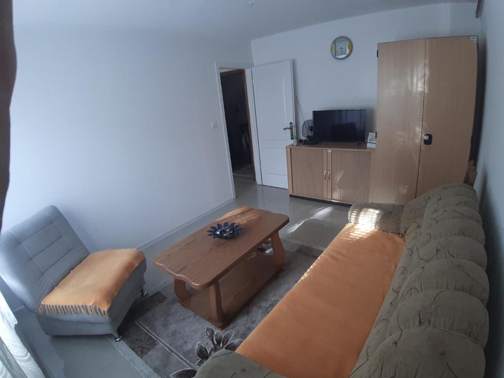 a living room with a couch and a coffee table at Ris in Foča