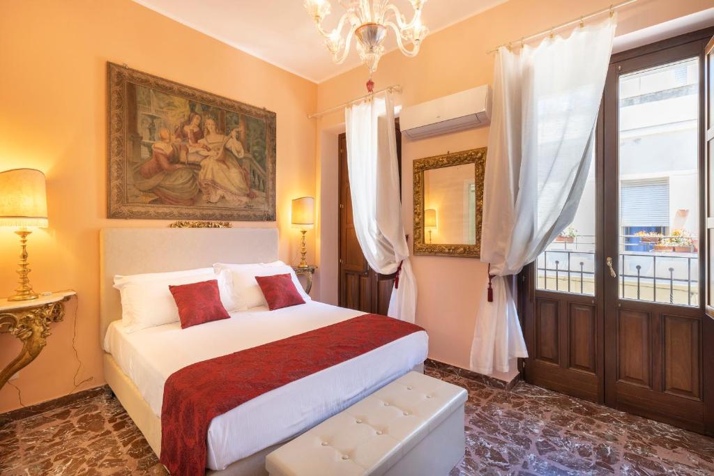เตียงในห้องที่ Saint George's House Appartamenti & Spa