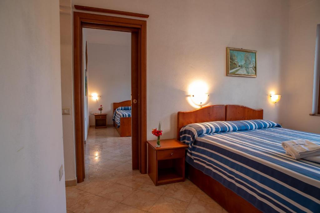 Postel nebo postele na pokoji v ubytování Villaggio La Pizzuta