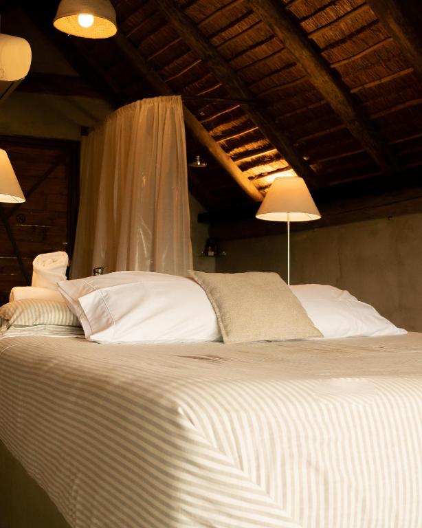 Postel nebo postele na pokoji v ubytování Tava Glamping Cerro