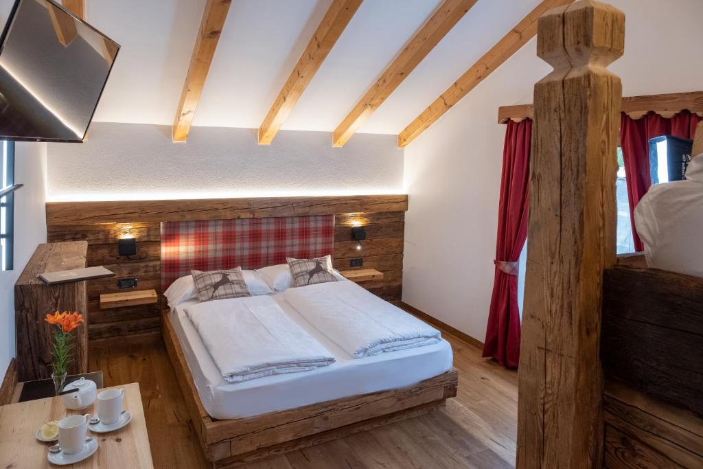Postel nebo postele na pokoji v ubytování Hotel Canada