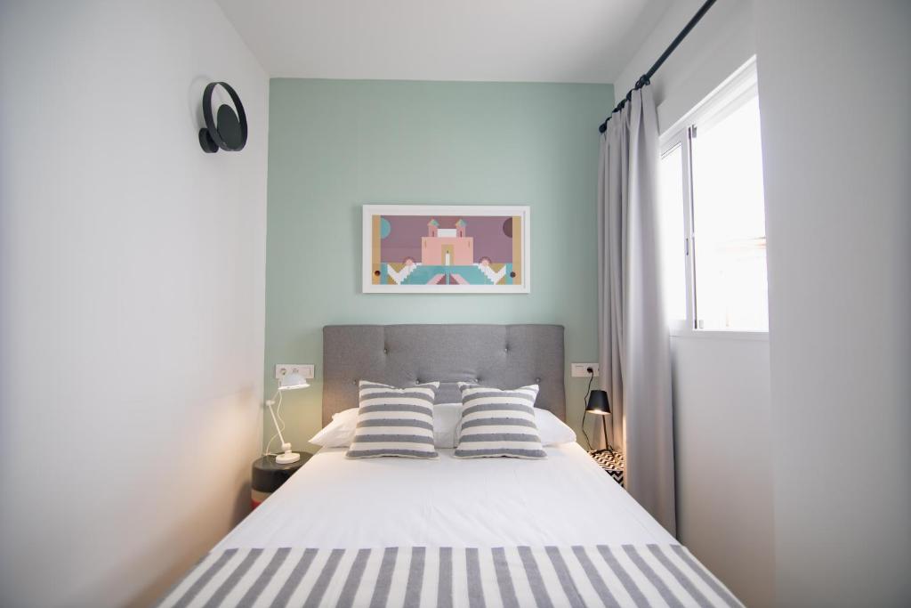 Posteľ alebo postele v izbe v ubytovaní Apartamentos Líbere Valencia Abastos