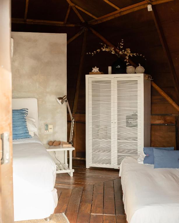 Postel nebo postele na pokoji v ubytování Tava Glamping Lago