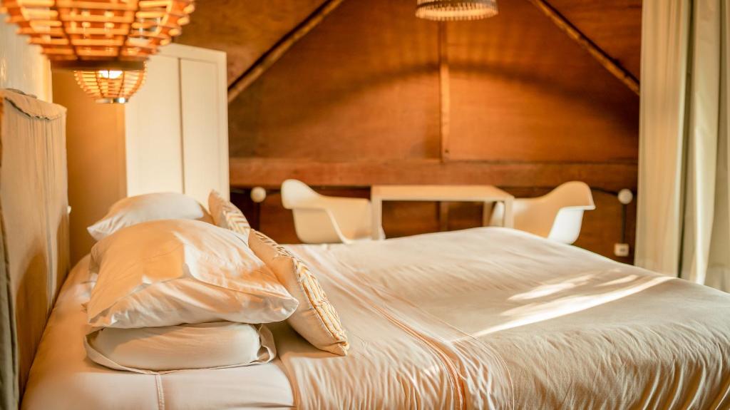 Postel nebo postele na pokoji v ubytování Tava Glamping Lago