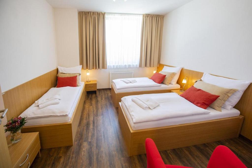 Postel nebo postele na pokoji v ubytování Hotel Berounka