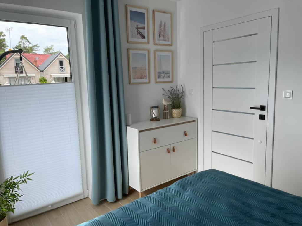 Łóżko lub łóżka w pokoju w obiekcie Apartament Baltic A8 Pobierowo