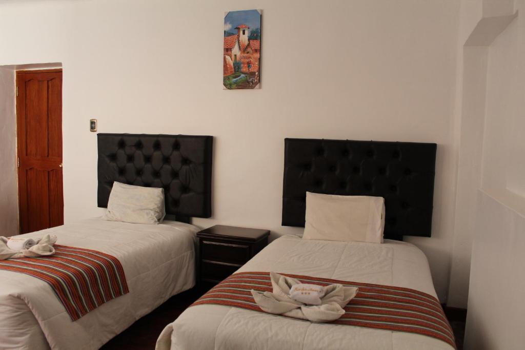 Postel nebo postele na pokoji v ubytování KAARO HOUSE CUSCO