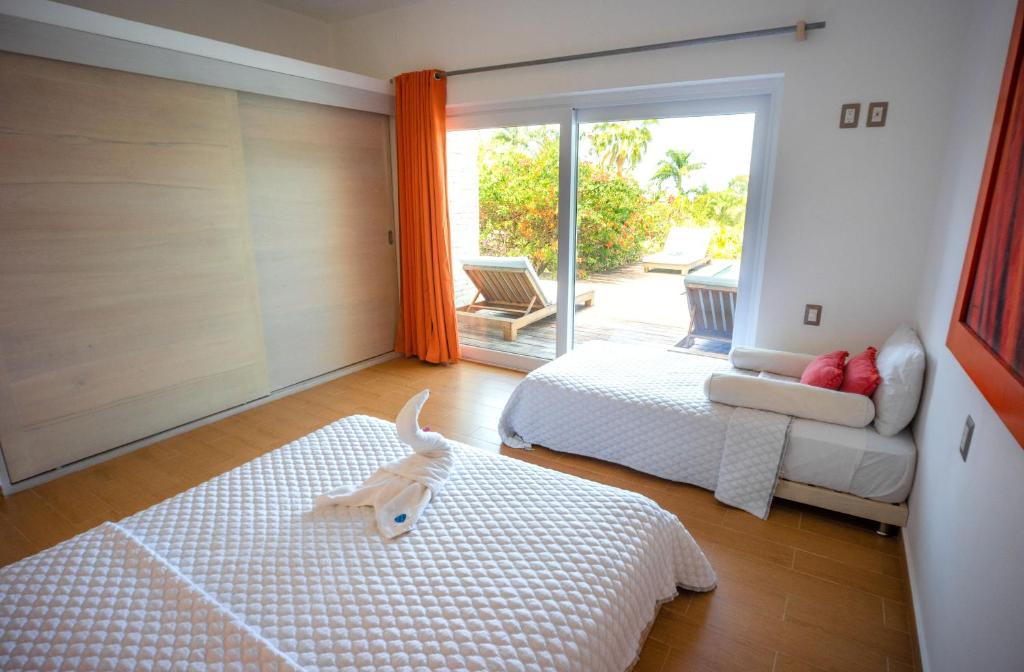 Postel nebo postele na pokoji v ubytování Villas Agua Dulce