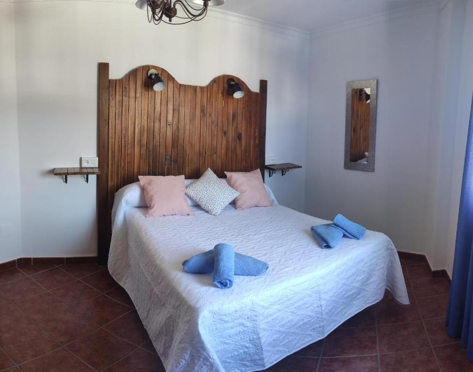 Cama o camas de una habitación en Hostal Vista a la Sierra