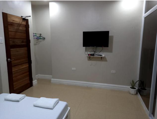 TV a/nebo společenská místnost v ubytování Sandscape Hotel
