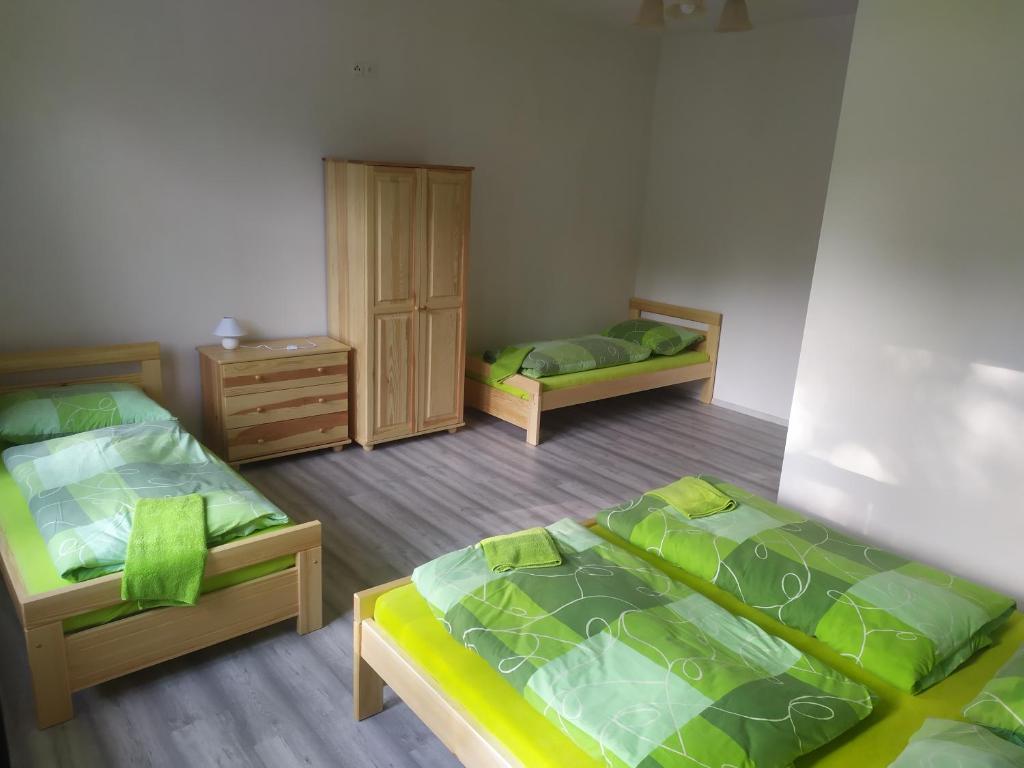 Postel nebo postele na pokoji v ubytování U Žabky