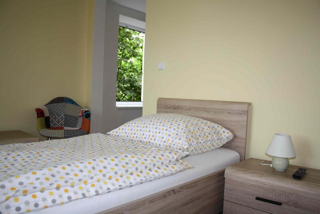 Postel nebo postele na pokoji v ubytování Ubytování Bludov u lázní