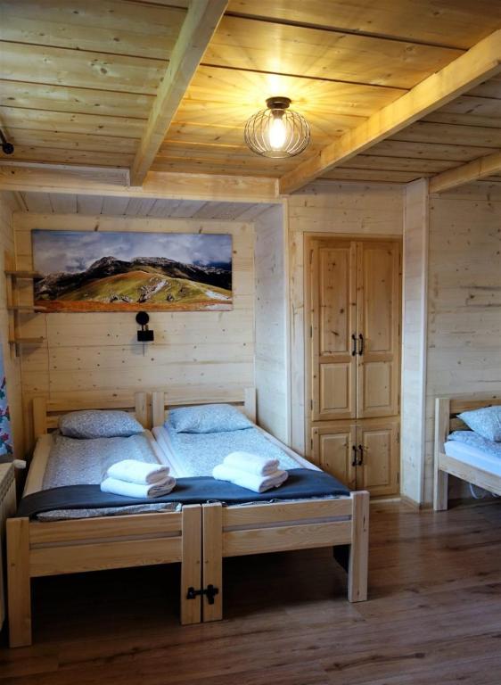 Posteľ alebo postele v izbe v ubytovaní Zakodomki Apartement Pyzdra