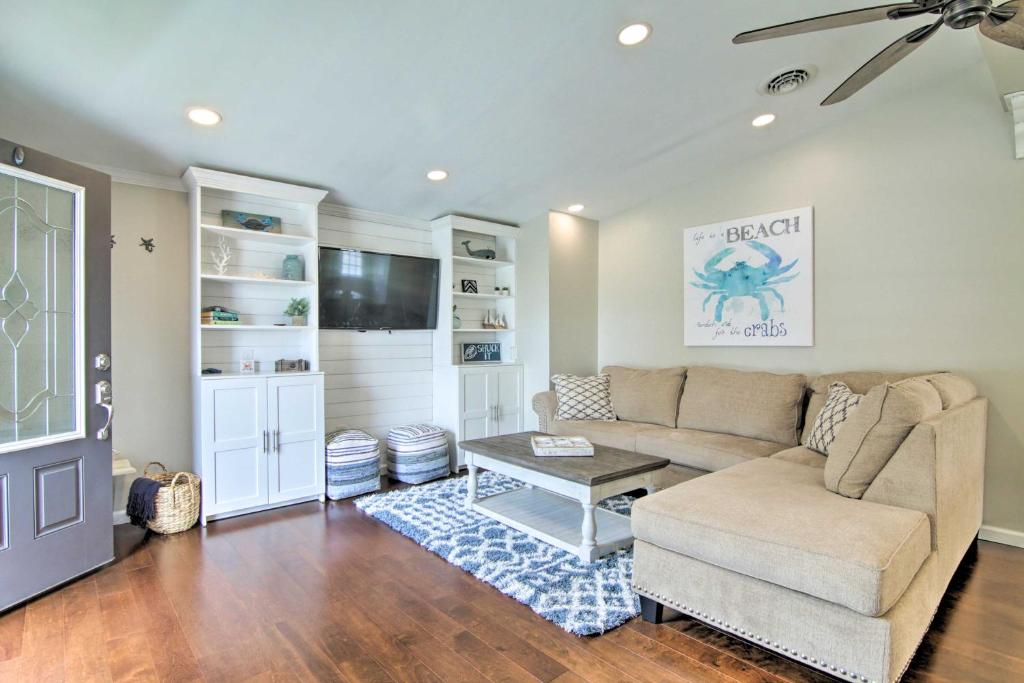 a living room with a couch and a tv at Pet-Friendly Ocean City Home Half Mile to Beach! in Ocean City
