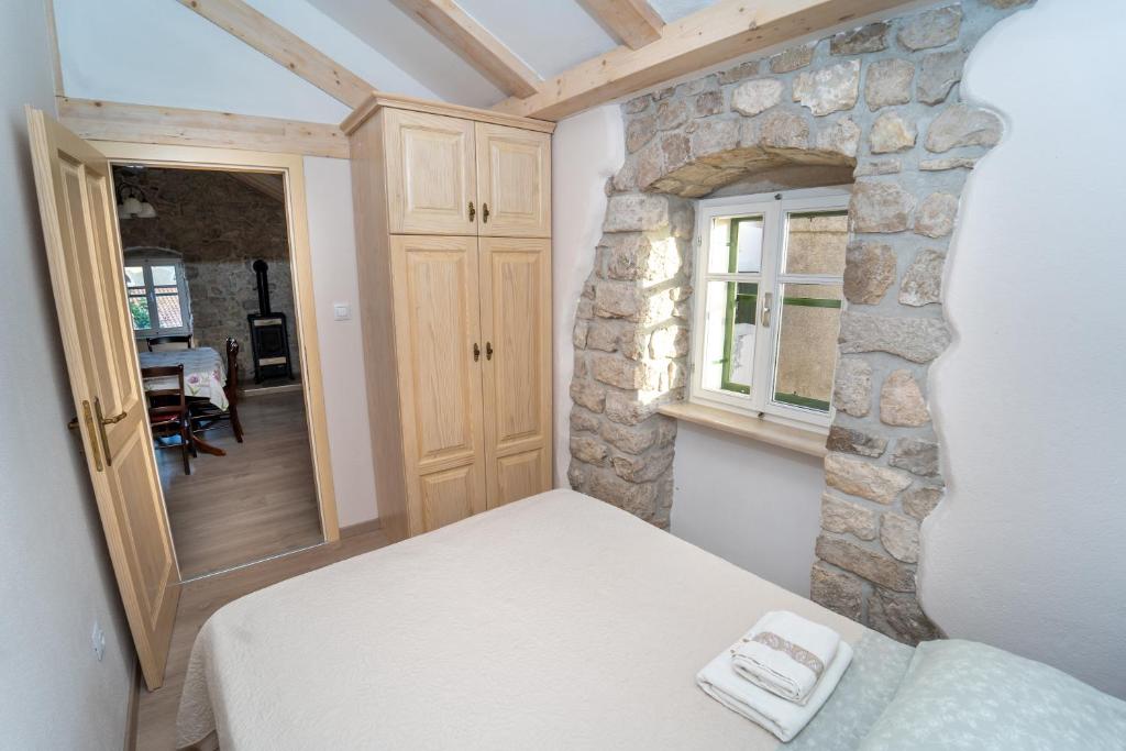 Postel nebo postele na pokoji v ubytování Apartman Nono Tone