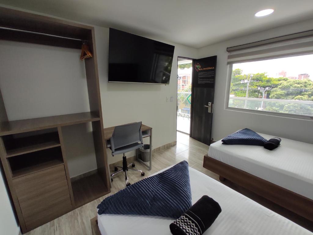 Postel nebo postele na pokoji v ubytování Hostel Boutique Nido de Loros