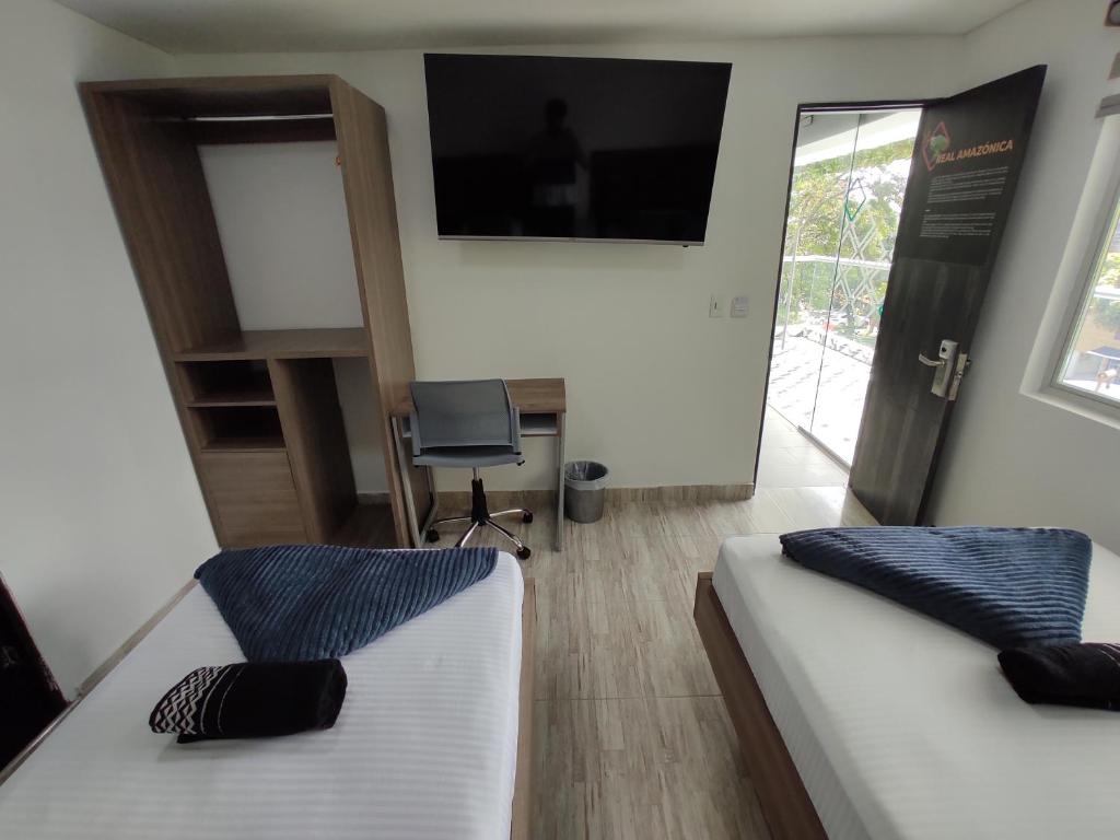 Postel nebo postele na pokoji v ubytování Hostel Boutique Nido de Loros
