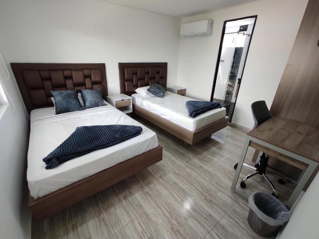 Postel nebo postele na pokoji v ubytování Hostel Boutique Nido de Loros