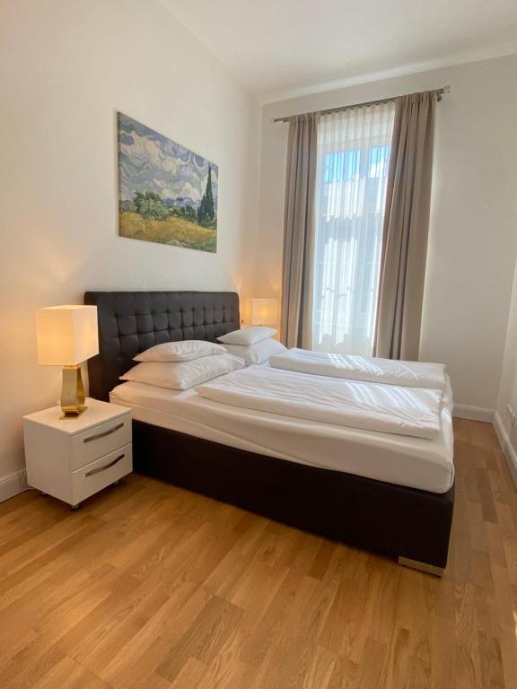 Posteľ alebo postele v izbe v ubytovaní Steiner Residences Vienna Taborstrasse