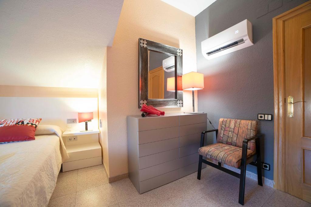 A bed or beds in a room at TurJalon - Apartamentos