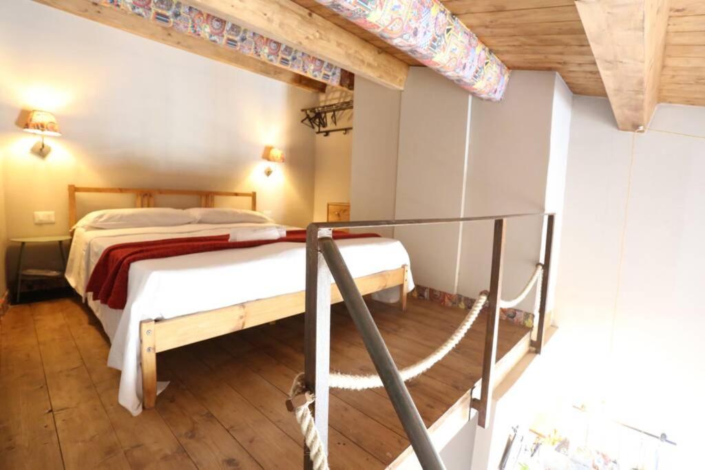 Postel nebo postele na pokoji v ubytování A timpa ro nannu - Appartamento 20