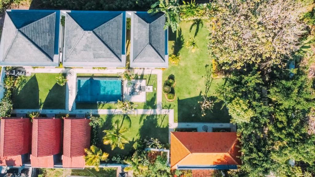 an overhead view of a house with a roof at Nyang - Nyang Bungalow Uluwatu in Uluwatu