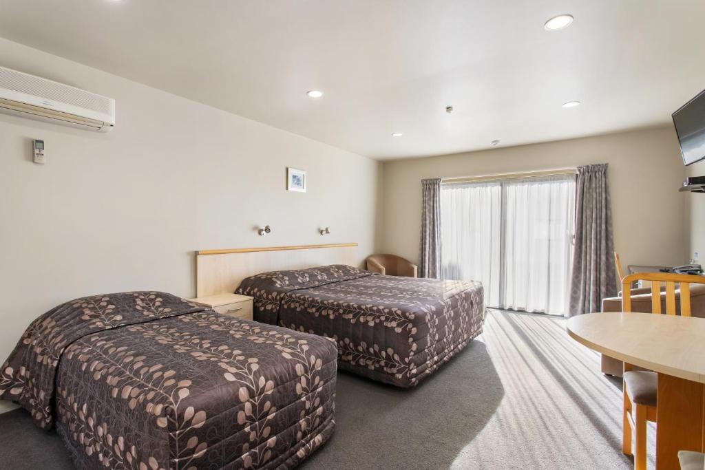 Postel nebo postele na pokoji v ubytování Kaikoura Gateway Motor Lodge